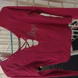 Pink long sleeve shirt. Open back and low v-neck.
